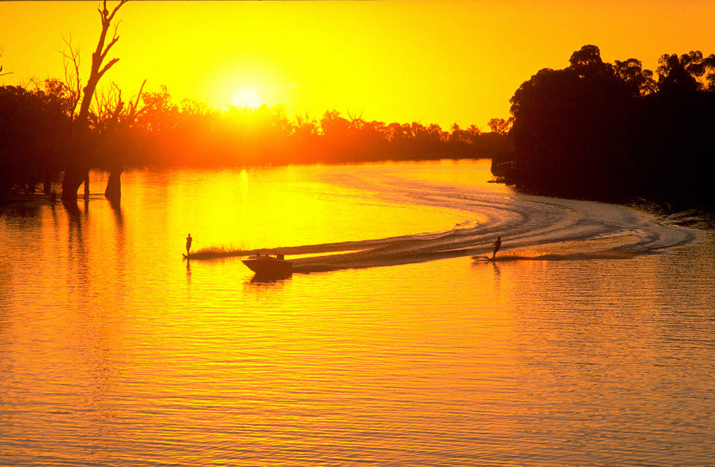 Water skiing sunset Murray River near Mildura