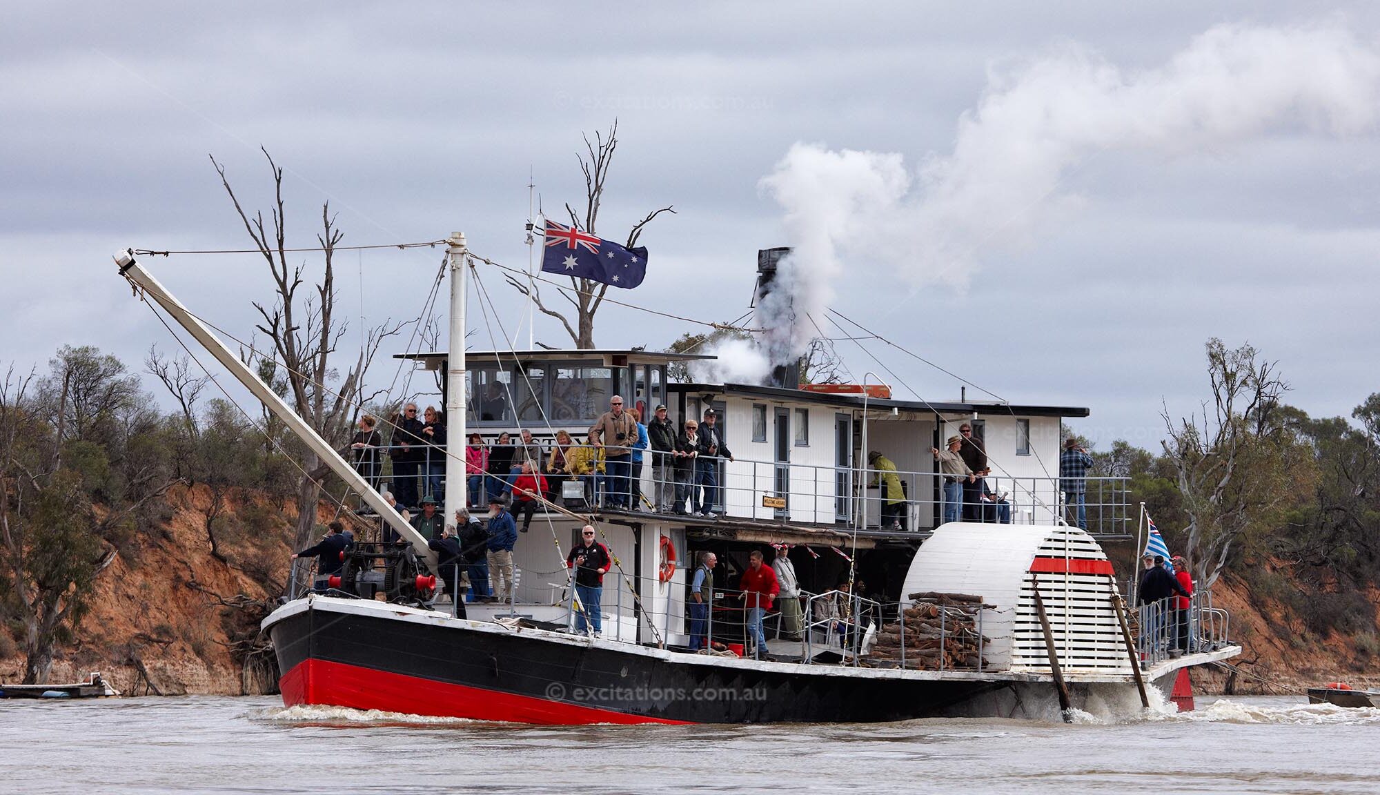 Paddle Boat, PS Industry on the Murray River downstream of Mildura. Under steam power, photographed on an overcast day.